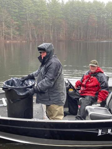 Men on boat stocking fish