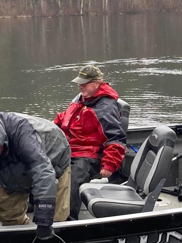 Men on boat stocking fish