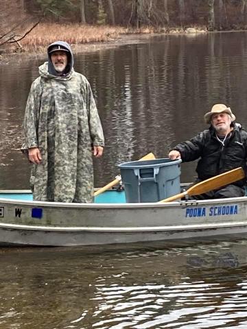 Guys on boat posing for photo